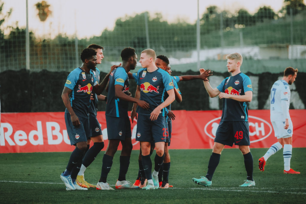 MARBELLA, SPAIN - JANUARY 20: Samson Baidoo celebrates with his teammates of FC Red Bull Salzburg after his goal during a test match between FC Red Bull Salzburg and Karlsruher SC on January 20, 2023 in Marbella, Spain. (Photo by Jasmin Walter - FC Red Bull Salzburg/FC Red Bull Salzburg via Getty Images)